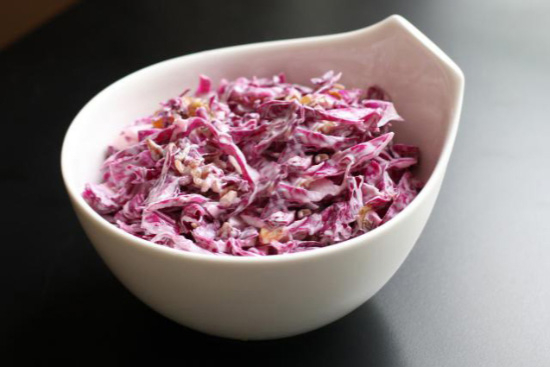 Warm red cabbage slaw with red onion and apple