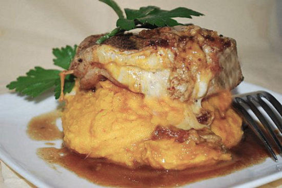 Stuffed pork chops with polenta and tomatoes